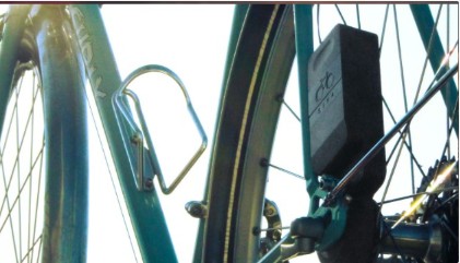 The bike-mounted generator fitted beside a bicycle wheel