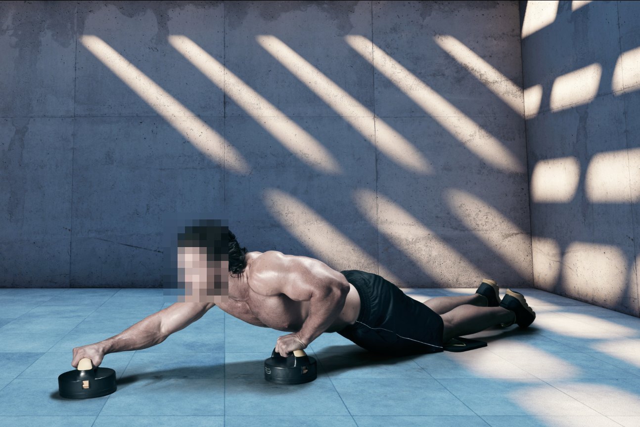 A man doing a push-up with a roller under each hand